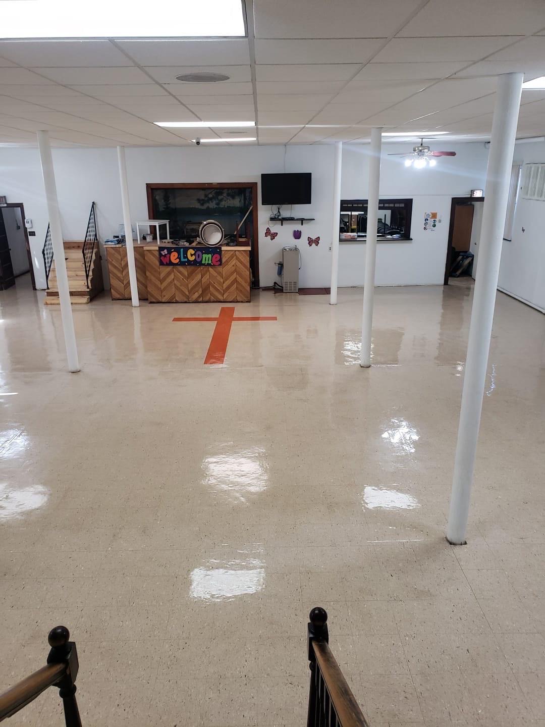 Completed floor waxing with mirror-like finish at church fellowship hall in Oak Lawn IL